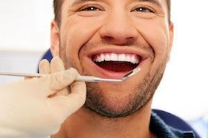 Man smiling in dental chair | dentist pascoe vale vic